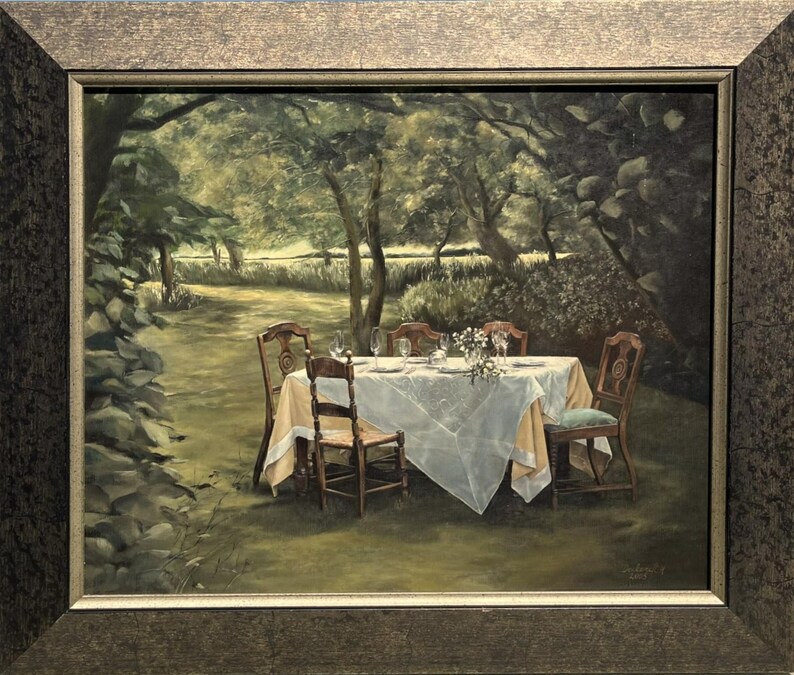 May include: Oil painting of a dining table set for a meal in a garden setting. The table is covered with a white tablecloth and set with plates, glasses, and flowers. Six wooden chairs surround the table, and the background features trees and foliage.