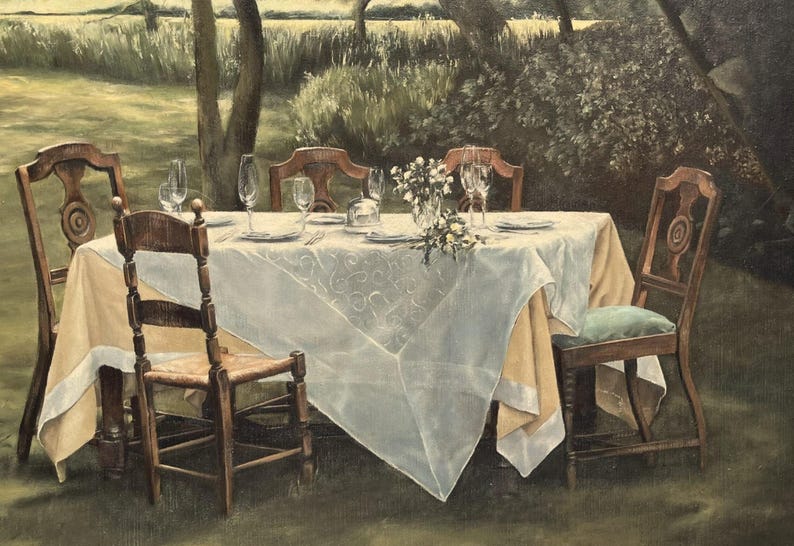 May include: An outdoor dining scene with a table set for a meal. The table is covered with a white tablecloth and set with plates, glasses, and silverware. Six wooden chairs surround the table, and a vase of flowers sits in the center.