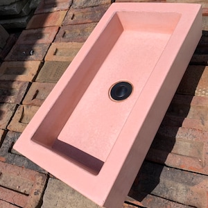 Pink concrete trough sink