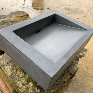 Concrete bathroom ramp sink