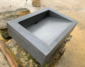 Concrete bathroom ramp sink