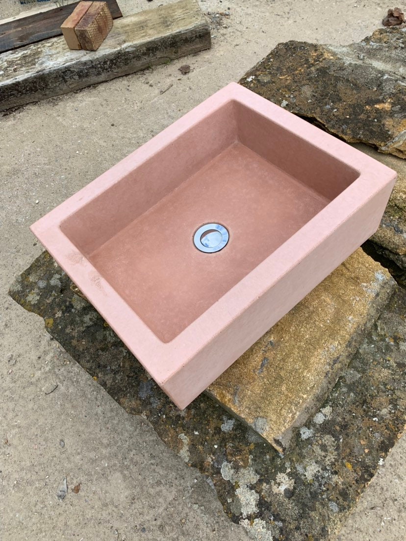 Pastel pink bathroom concrete sink