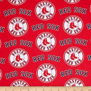 May include: Red fabric with a repeating pattern of white circles containing the words "Boston Red Sox" and a baseball player's legs wearing red socks. The words "Red Sox" are also repeated in a larger font.