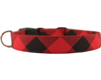 May include: Red and black buffalo plaid dog collar with a metal D-ring and a plastic buckle.
