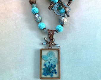Flower petal resin brass pendant w/mixed turquoise Czech glass, resin, brass beads & a verdigris brass toggle clasp-Boho Chic necklace