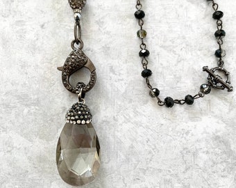 Pave' crystal drop pendant on pave' lg. lobster clasp on faceted iridescent crystal bead chain- 18.50" necklace