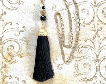 Boho glam long tassel necklace-etched metal cap black silk tassel, black faceted & Venetian glass beads on multi strand matte gold chain