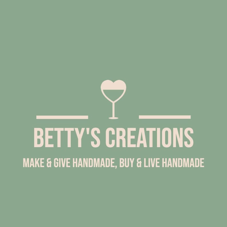 May include: Logo for Betty's Creations, featuring a wine glass with a heart-shaped top. The text reads "Betty's Creations" above the tagline "Make & Give Handmade, Buy & Live Handmade" on a muted green background.