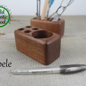 Small sapele desk caddies for holding 4 pens and other small stationary.