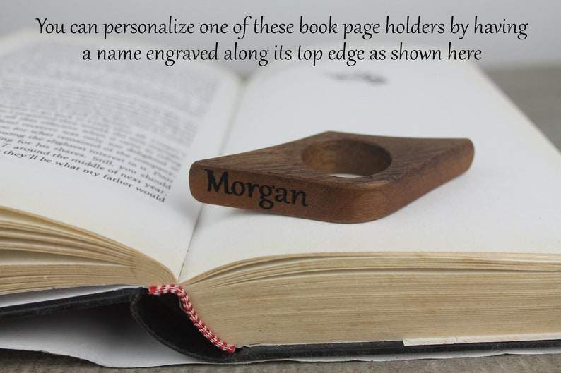 May include: A wooden book page holder with a diamond shape and a ring for holding the page. The holder is engraved with the name "Morgan".