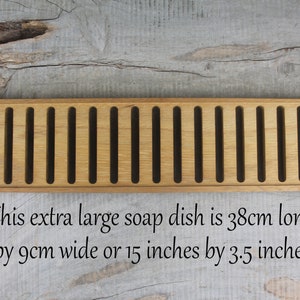 May include: A wooden soap dish with 10 slots. This extra large soap dish is 38cm long by 9cm wide or 15 inches by 3.5 inches.