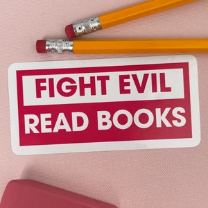 May include: White sticker with a red border and the text "FIGHT EVIL READ BOOKS" in white letters.