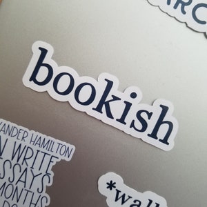 May include: A white sticker with the word "bookish" printed in dark blue letters.