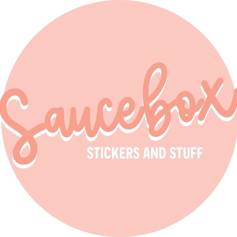 May include: A pink circle with the text "Saucebox" in white outlined pink lettering. Below the text is the phrase "Stickers and Stuff" in white lettering.