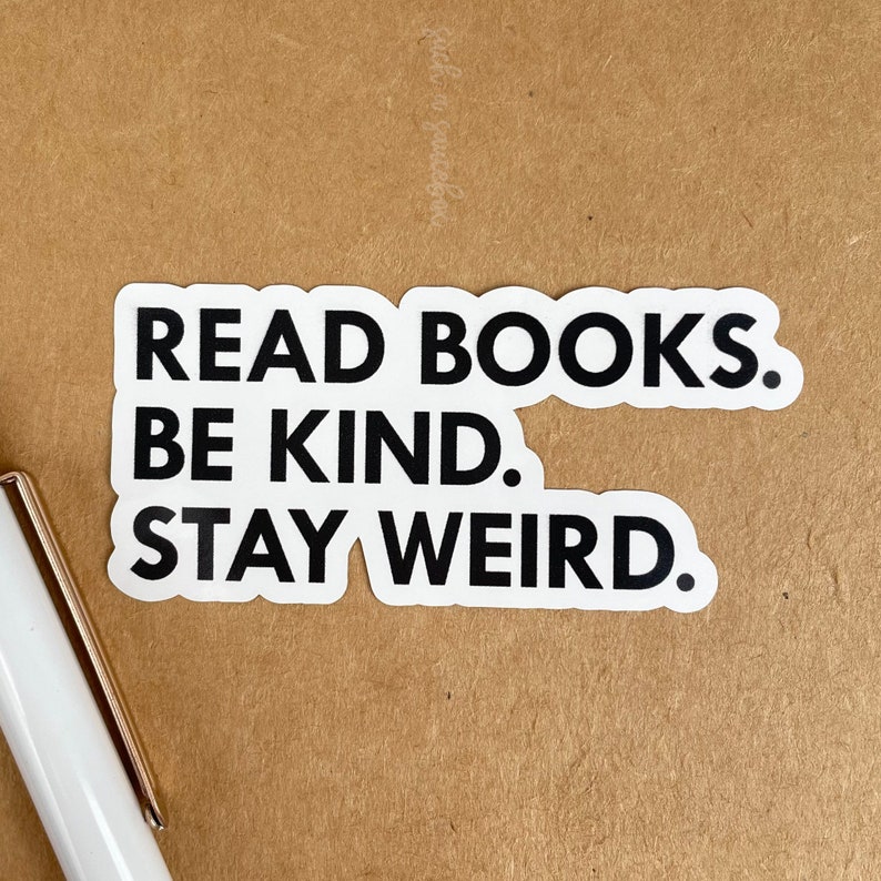 May include: White sticker with black text that reads "Read Books. Be Kind. Stay Weird."