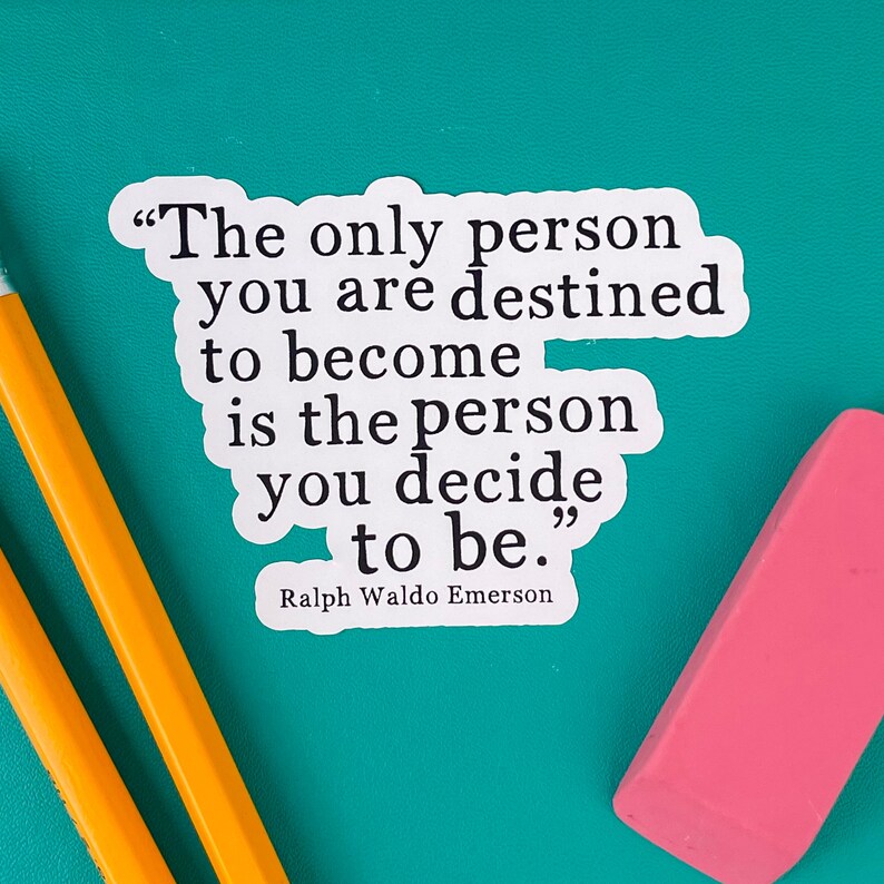 May include: A white sticker with a black inspirational quote by Ralph Waldo Emerson. The quote reads, "The only person you are destined to become is the person you decide to be."