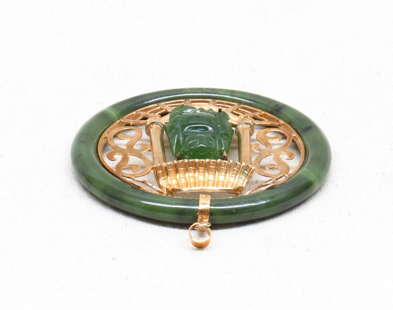 Large Vintage Hand Carved Chinese Spinach Jade Hotei Buddha Sitting in a Golden Pagoda Pendant.