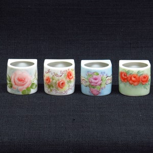 Set of Four Beautifully Hand Painted Rose Motif Ceramic Napkin Ring Style Holders