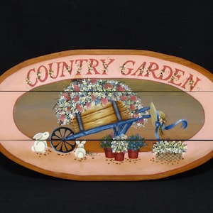 Cute Hand Painted Wood &quot;Country Garden&quot; Oval Wall Hanging Plaque Old Timey Wheelbarrow Full of Flowers and Bunnies