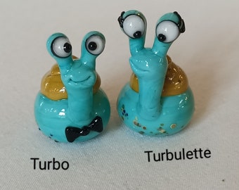 Couple of turquoise glass snails