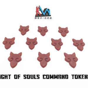 Peut inclure: Onze jetons de commandement brun-rouge en forme de têtes de loup stylisées, disposés sur fond blanc. Le texte "BLIGHT OF SOULS COMMAND TOKENS" est imprimé en noir en gras en dessous. Le logo KM Designs est en haut à gauche.