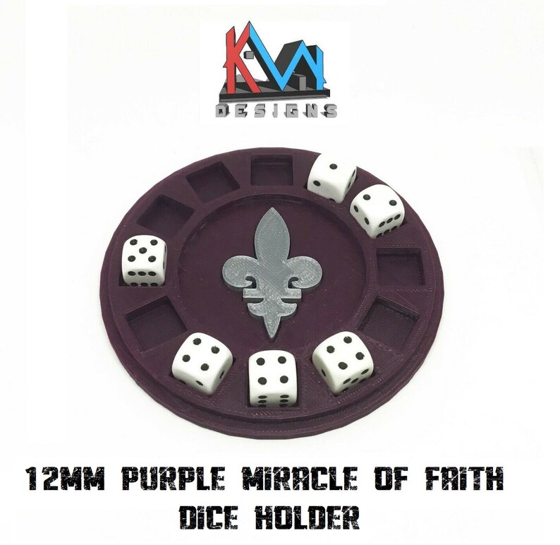 May include: A purple dice holder with a fleur-de-lis design in the center, holding six white dice with black dots. The holder has square compartments for dice and the text "12MM PURPLE MIRACLE OF FAITH DICE HOLDER".