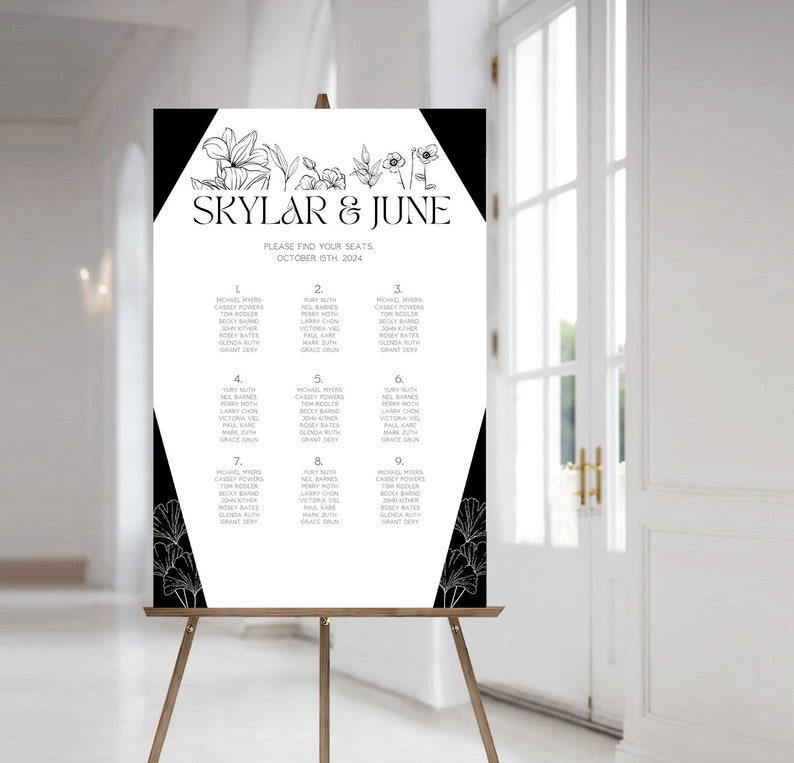 May include: Black and white wedding seating chart with floral accents. The chart lists guest names and table numbers for a wedding reception. The text reads "Skylar & June, Please find your seats, October 15th 2024."