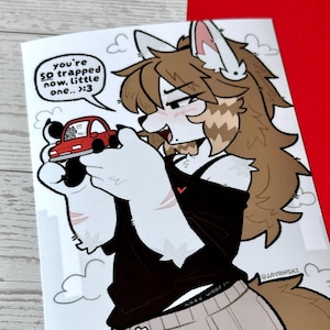 May include: A digital illustration of an anthropomorphic wolf character with brown hair, wearing a black top and beige sweatpants, holding a small red toy car. A speech bubble contains the text: you're SO trapped now, little one.. :>3