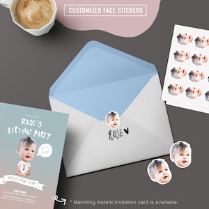 May include: A white envelope with a blue lining and a personalized face sticker with the name "Rose" on it. The envelope is next to a birthday invitation card with a photo of a baby wearing a onesie with the number "1" on it. The invitation card says "Rise's Birthday Party" and "Let's Play!" The invitation card also includes the date "Nov 27, 2018" and the time "11 AM".