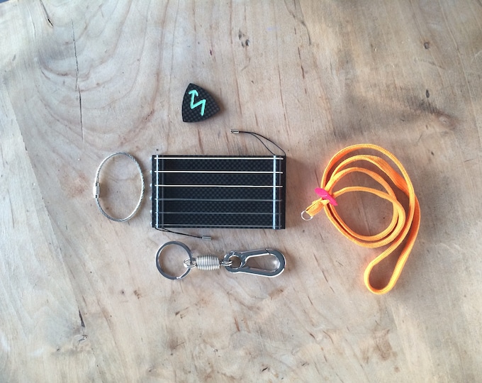 Fast Fingers Guitar Trainer Plate on Real Carbon Fiber with Real Cords