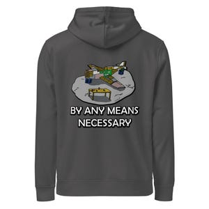 May include: Dark gray hoodie with a graphic of a cartoon airplane, a small table, and the text "BY ANY MEANS NECESSARY" in white. The airplane has green, yellow, and brown accents. A casual, comfortable garment.