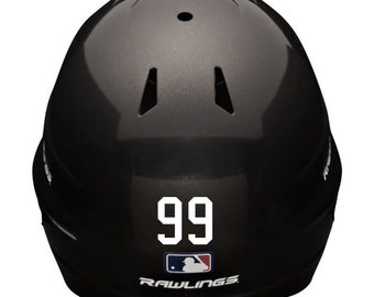 May include: Black baseball helmet with a white number 99 on the front. The helmet has a Rawlings logo on the bottom.