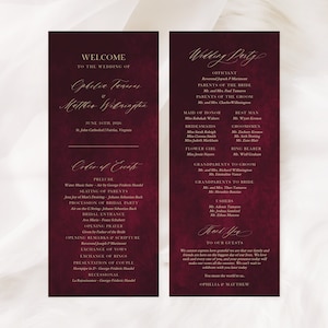 May include: Burgundy wedding program with gold lettering. The program includes the order of events, wedding party, and a welcome message to the guests. The text reads "Welcome to the wedding of Ophelie Teneres & Matthew Webringen, June 16th, 2026, St. John's Cathedral, Fairfax, Virginia".