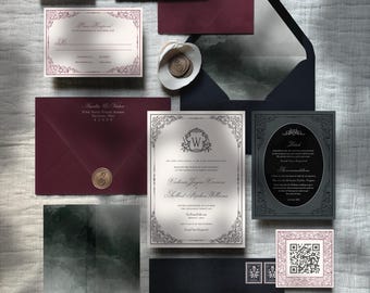 May include: A wedding invitation suite with black and burgundy envelopes, a white invitation with a silver ornate border, and a black and silver RSVP card. The invitation features a silver monogram with the letter W and the text "Victoria Jayne Varner & Mr. Stephen Williams".