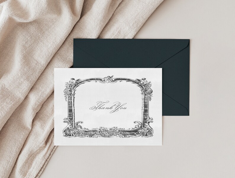 May include: A white card with a black ornate frame and the text "Thank You" inside the frame.