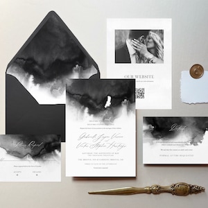 May include: Black and white wedding invitation suite with watercolor-style designs. The invitation features the couple's names and wedding date. The RSVP card includes a black and white watercolor design and the text "Please respond by the first of October". The details card features a black and white watercolor design and the text "Formal attire requested".