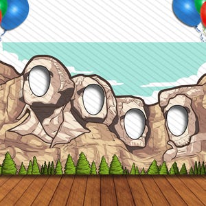 May include: A photo booth prop featuring a cartoon depiction of Mount Rushmore with face cutouts. The backdrop includes a blue sky, clouds, and green trees. Balloons in red, green, and blue are in the upper corners.