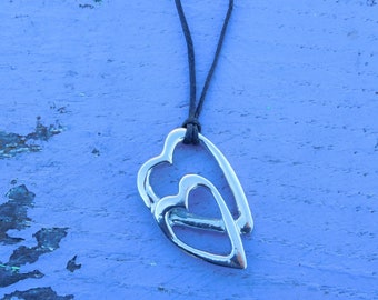 Collier en plaqué or chaîne avec pendentif coeur avec recto pavé d'oxydes blancs et verso en