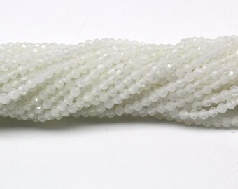 thumbnail interactive-video image 1 of 10mm Glowing Milky White Opalite Glass Faceted Round Beads – 12 Pieces 1 of 6