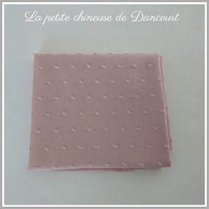 Coupon of feathered pink fabrics withered