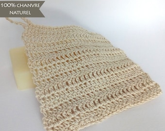 May include: A beige crocheted soap saver made from 100% hemp, labeled "100% CHANVRE NATUREL".
