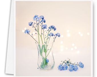 Photo greeting card of forget-me-not flower in a small vase and lights, flower greeting card, birthday card, flower photo,