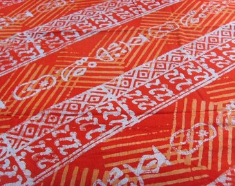 Batik au mètre - rouge, saumon, blanc - motifs adinkras - bkvl20