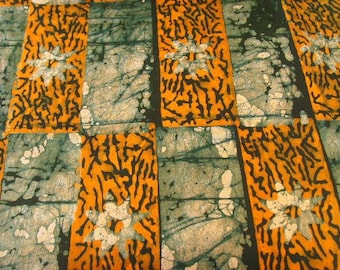 Batik au mètre - orange, vert, blanc - motif Nsoromma - bkbz47