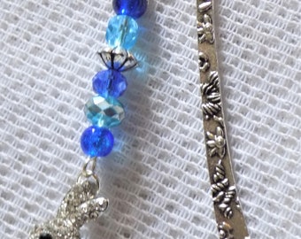 Finely carved silver bookmarks, metal beads, blue glass beads, blue rabbit pendant garnished with rhinestones.