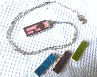 Perfume diffuser pendant necklace, rectangle pendant, rose motif, glass bead, metal bead, silver and pink colors.