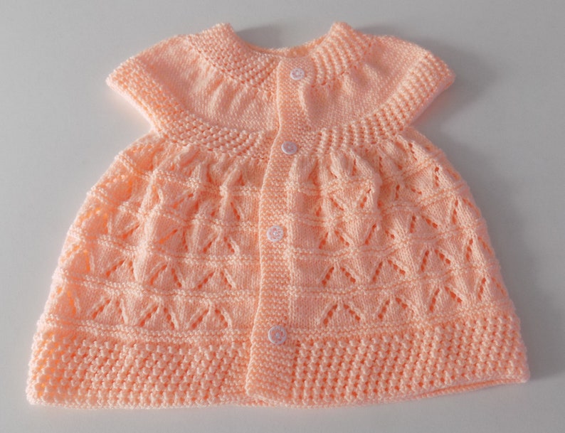 Hand-knitted baby dress, salmon color, size 3 to 6 months. image 2