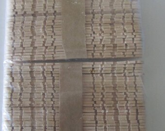 set of 100 notched natural wooden sticks