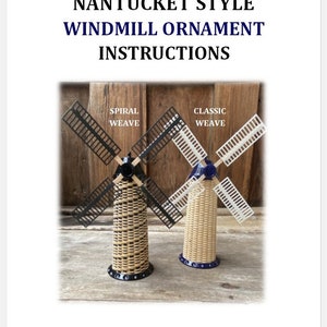 May include: Two Nantucket style windmill ornaments, one with black blades and a spiral weave and the other with white blades and a classic weave. Both are approximately 6.5 inches tall, not including the blades.