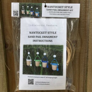 May include: A kit to make a Nantucket style sand pail ornament. The kit includes a mold, instructions, and supplies for one sand pail. The finished ornament is approximately 8 inches tall.